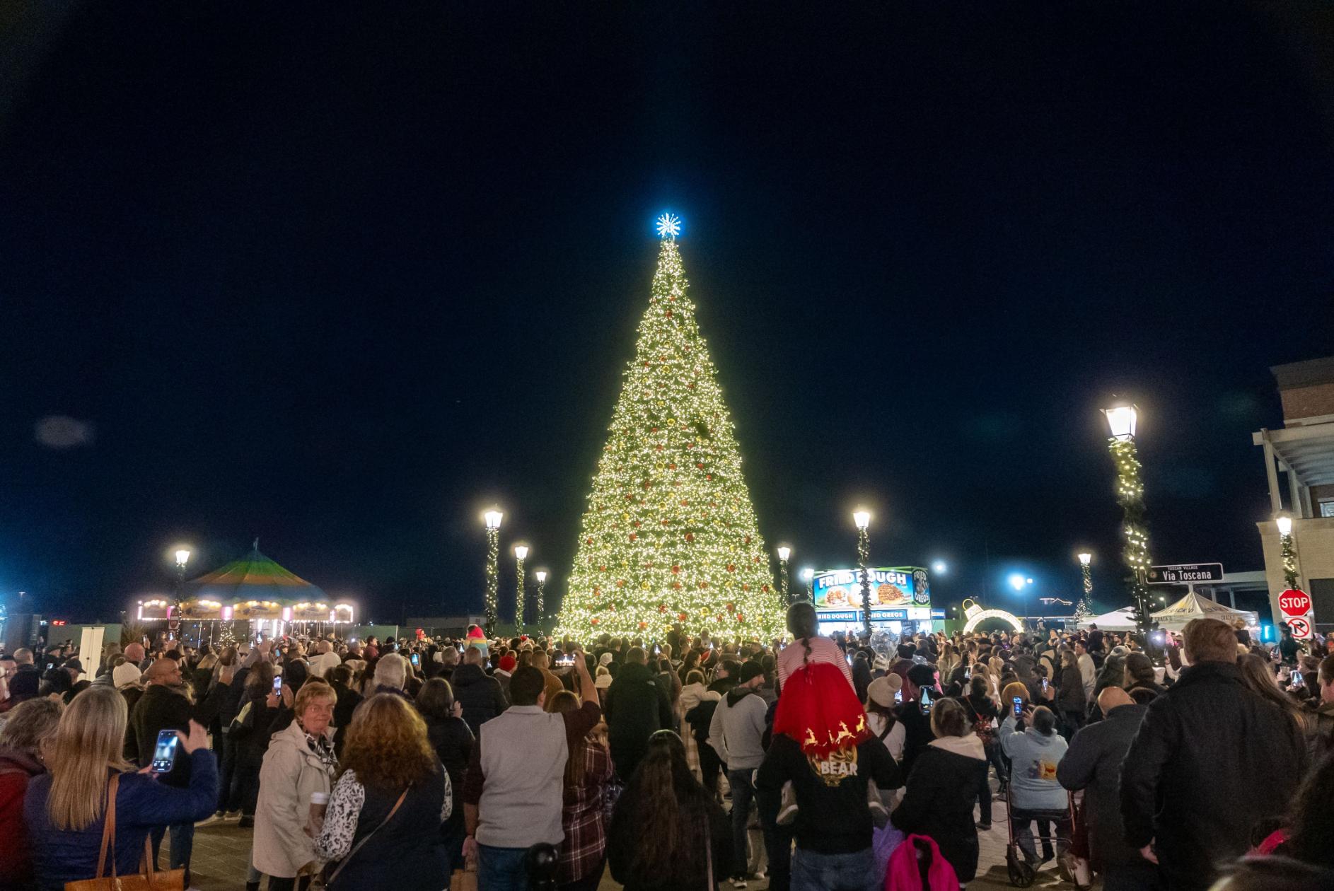 Crowds around a Christmas tree in Tuscan Village, Salem, NH